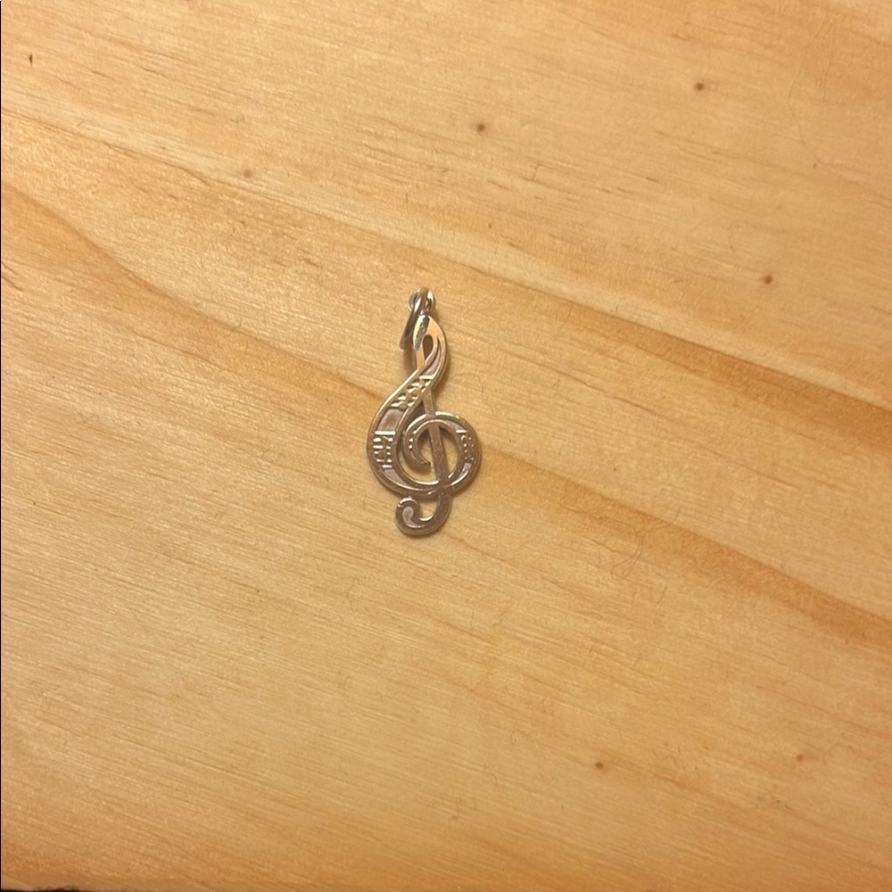 Elegant Gold Treble Clef Pendant